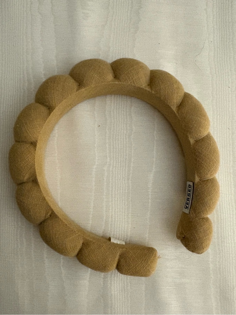 Versed croissant style tan linen headband